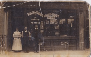Goldstein pic 4 Morris_father_shop  Sarah & David Goldstein stand outside the Mile  End boot shop that was the family business, c. 1905.jpeg